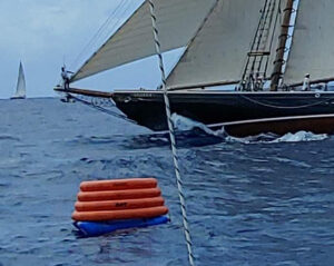 A robotic mark near a yacht.