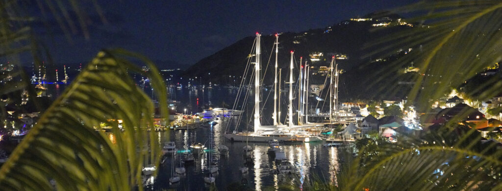 Photograph of yachts in the St Barths harbor at night.