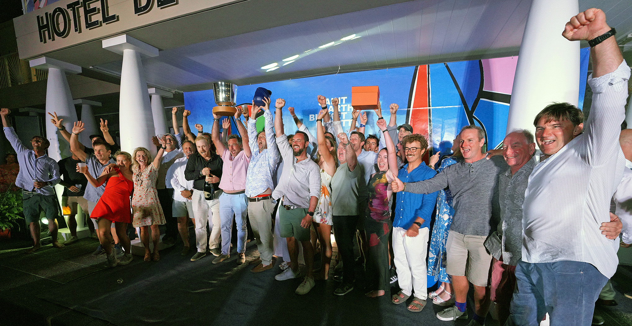 Photo of the crew of HETAIROS celebrating at the 2026 St Barths Bucket Regatta.