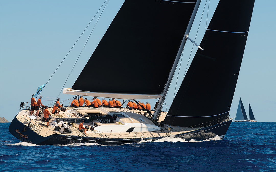 Photograph of the super yacht Hummingbird racing at the St. Barths Bucket Regatta. Photo © Michael Kurtz.