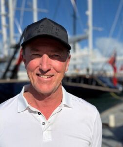 Photograph of Tony Rey standing on a dock at the 2026 St. Barths Bucket Regatta.
